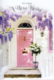 This doorway scene in Lower Clapton feels like the first deep breath you take after the boxes are stacked inside and the keys are finally yours. A softly painted pink front door stands at the centre, its warm blush tone radiating friendliness against whitewashed walls that catch and gently diffuse the afternoon light. Above and around the entrance, wisteria spills down in lush lavender strands, each trailing cluster brimming with tiny petals that look almost feathery at the tips. The cascading blooms form a relaxed archway, echoing the kind of romantic greenery that winds through many of the quieter residential streets near Hackney Downs. On the doorstep, a sturdy grey metal florist's bucket serves as an understated pedestal for a generous arrangement of white and cream roses. The roses are full and layered, their petals curling outward in velvety spirals, and they are interlaced with soft green foliage that adds depth and a whisper of woodland freshness. A pale pink ribbon is tied around the base of the bucket, its colour perfectly harmonising with the pink of the door and giving a sense of thoughtful, handcrafted design. Soft sunlight filters through the curtains of wisteria, sprinkling delicate shadows across the steps and hinting at movement in every petal and leaf. The entire composition feels calm, hopeful, and intimate: a housewarming bouquet that might have been delivered by a trusted local florist, placed carefully at the threshold of a new Lower Clapton home to welcome in laughter, shared meals, and the quiet joys of everyday life beginning in a fresh space.